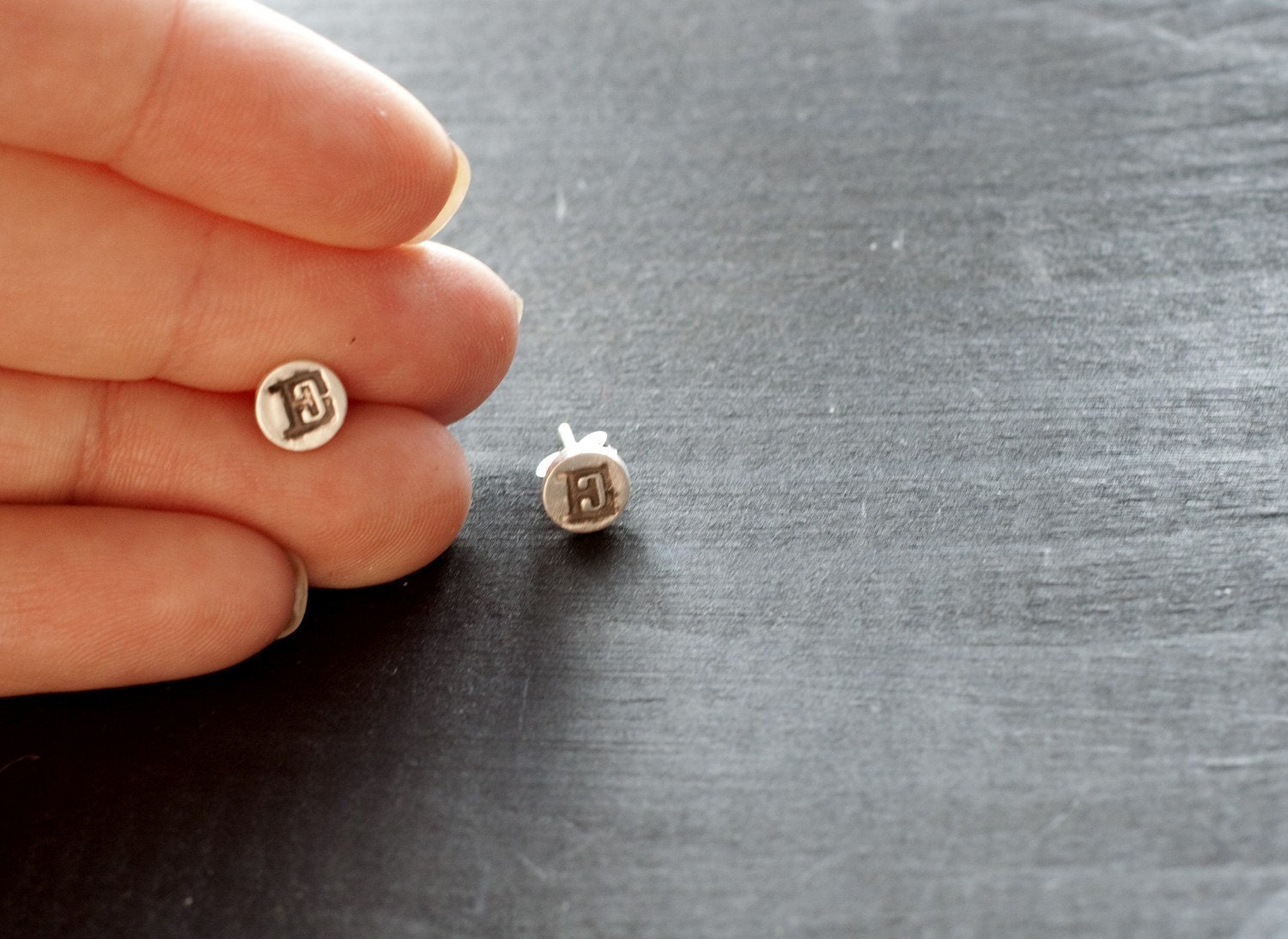initial earrings.