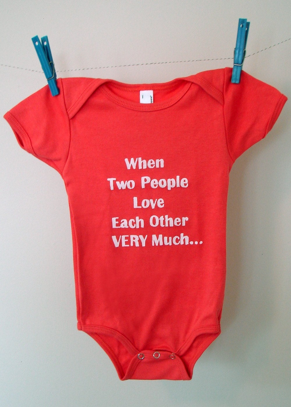 When Two People Love Each Other Very Much Onesie size 6-12mos (coral/white)