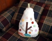 Pear shape cushion with a tree