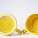 Two vintage cups stacking ceramic raindrop pattern - caramel yellow mugs with rain drops