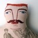 red-haired man with boat tattoo