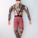 tattooed man doll
