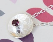 Circles etched pendant with rhodolite gemstone