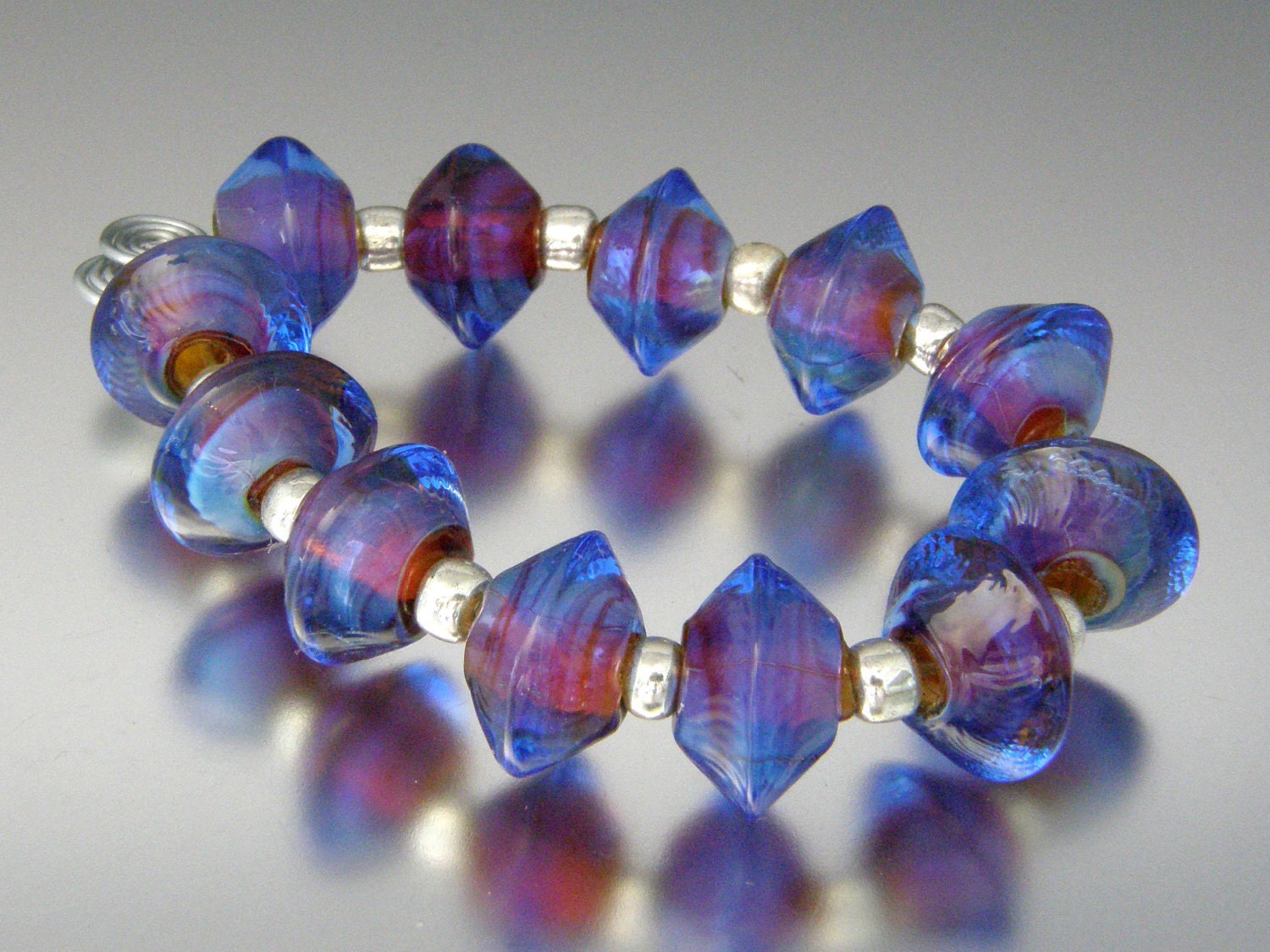 KILLERBEEDZ1 - Rasberry Blue - 12 Stubby Bicone Lampwork Beads