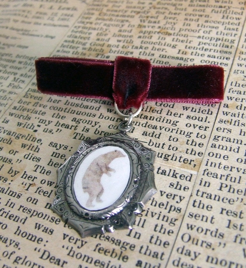 Walking Bear brooch with maroon ribbon
