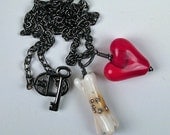 encrusted bone and red heart, lampwork glass and fine silver