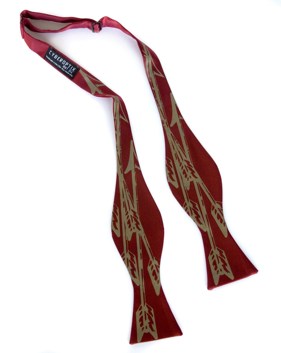 Burgundy Arrows bow tie, freestyle. Silkscreened necktie, antique brass print. "Quiver."