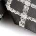 Tartan bicycle chain black necktie. Dove gray silkscreen print. Microfiber. Diamond bike chain tie. Choose standard, narrow or skinny.