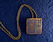 Distressed and faded tile pendant