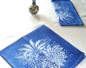 pair of dinner napkins. lapis blue chyrsanthemum