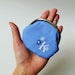 Personalized coin purse in blue with white initial and flowers