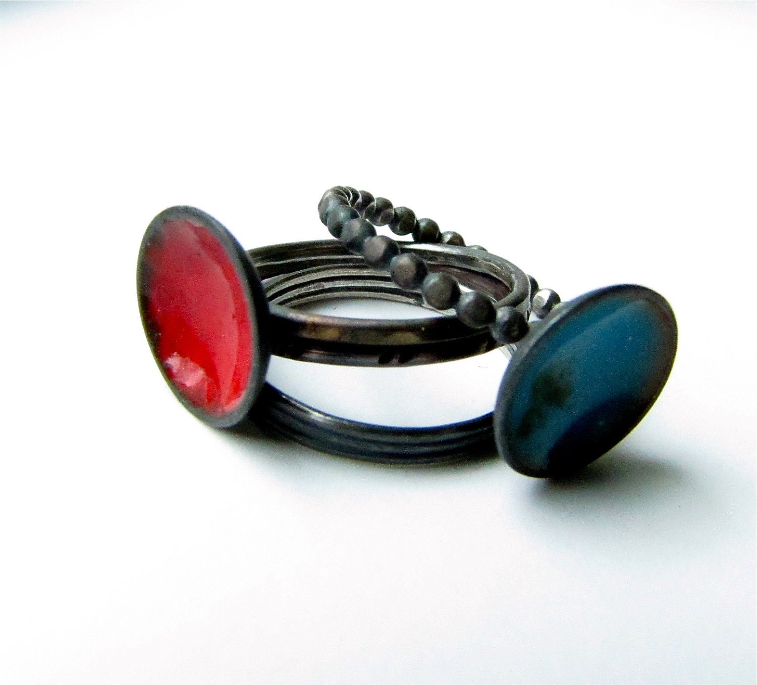 Shocked torch fired enamels, sterling silver and copper stacking four ring set