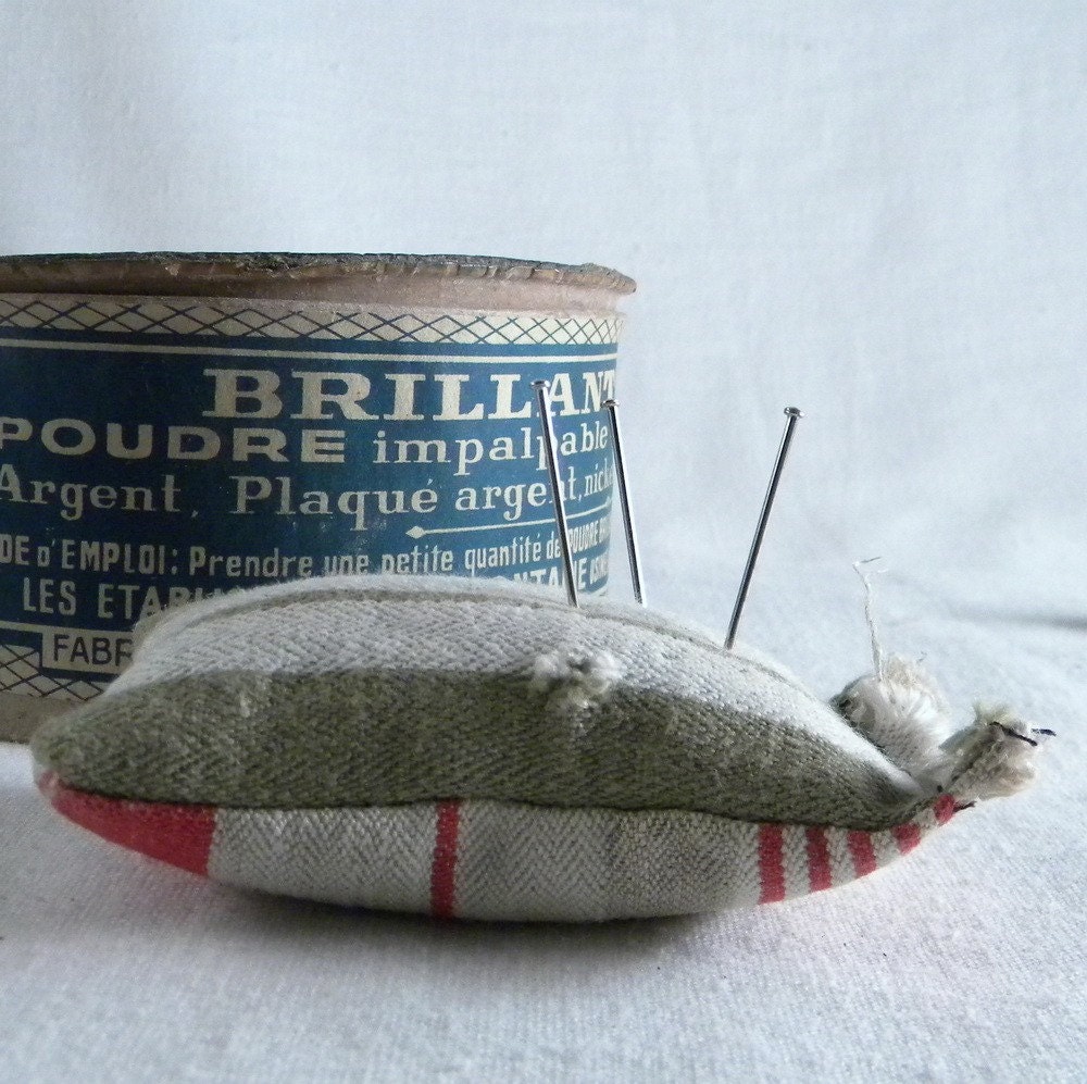 Vintage sewing kit with scissors, lace, lace bobbin, buttons, tin box, pincushion, thimble