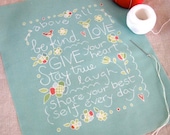 above all, be kind - stitch sampler and pillow front