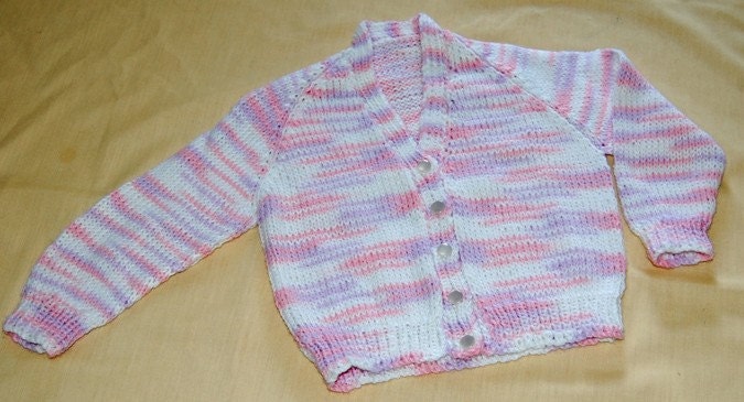 Infant girl size 9/12 months cardigan sweater in variegated pink/lilac/white baby yarn.