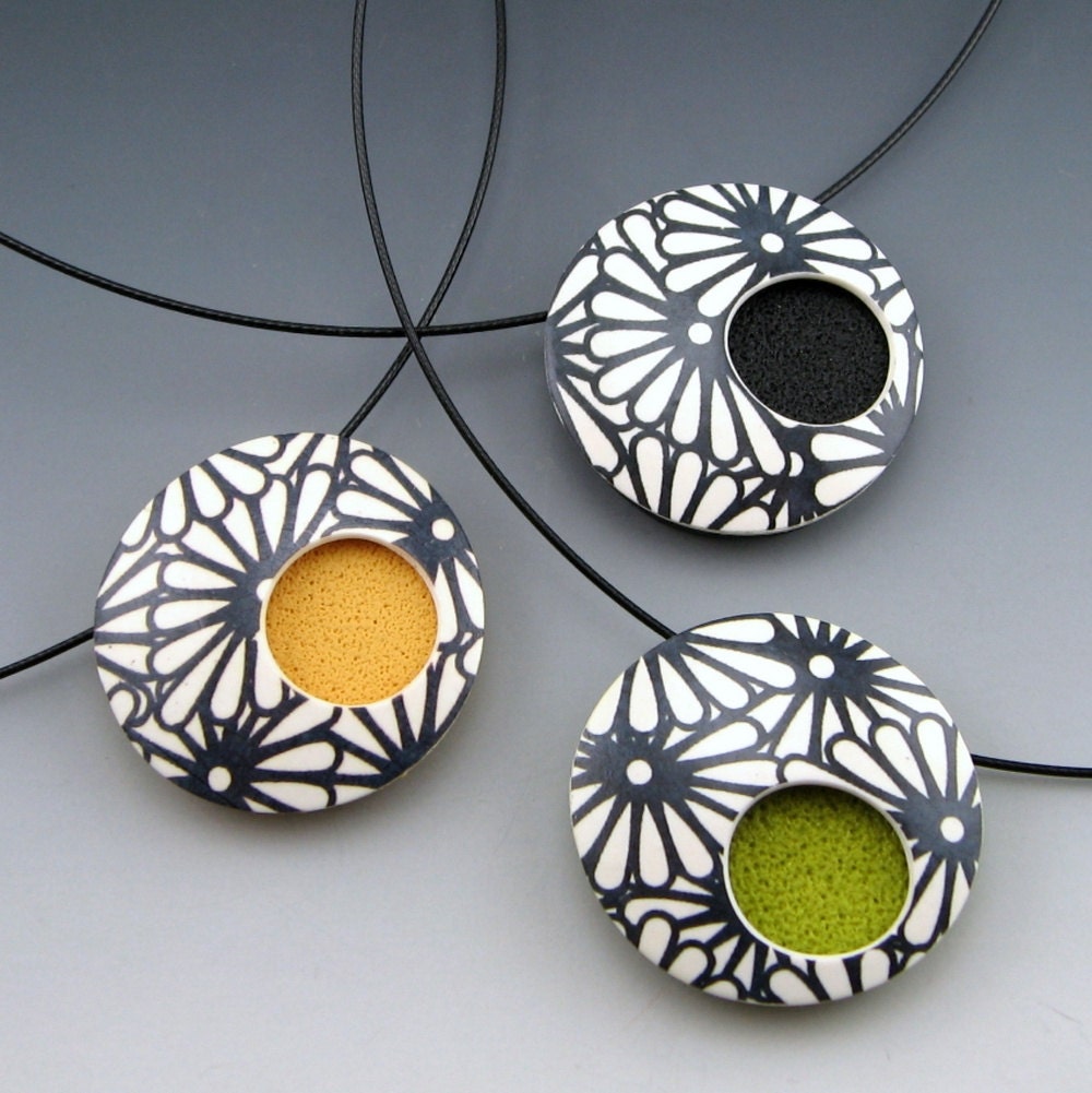 Contemporary polymer clay pendant necklace in modern black and white design on choker neckwire
