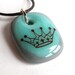 Crown on Aqua. A fused glass pendant necklace.