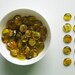 12 Glass Gems Marbled Yellow in a Square Tin Box