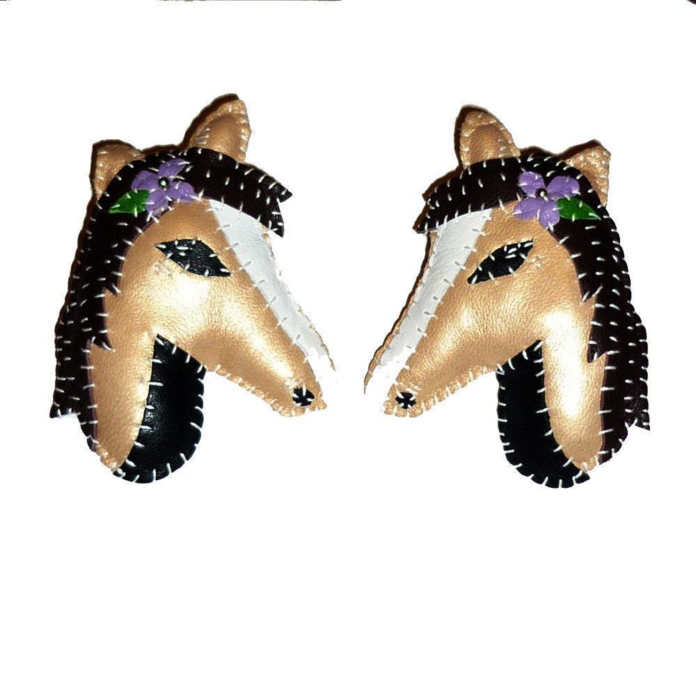 Pair of Leather Horse Brooches