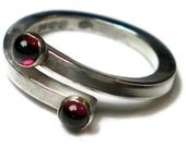 You and I a Sterling silver ring with 2 garnet cabochon gemstones