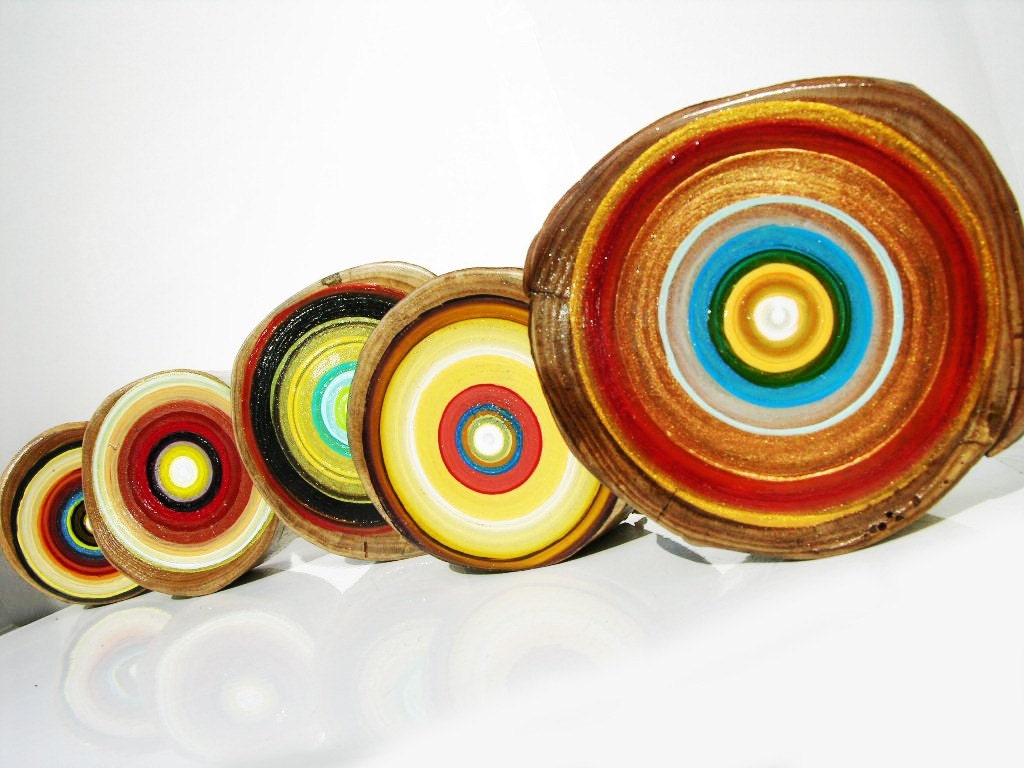 Fill your living room with a friendly  happy  young vibe with this group of colorful tree ring paintings