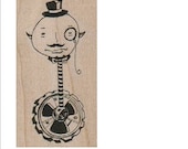 Steampunk Man Moon Face on a gear unicycle unmounted rubber stamp steampunk style designer Mary Vogel Lozinak