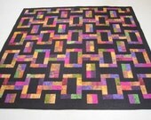 Bright Scraps Combined with Black for a Contemporary Quilt in Twin/Large Lap size