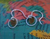 braided open circle with xs gold disc earring.