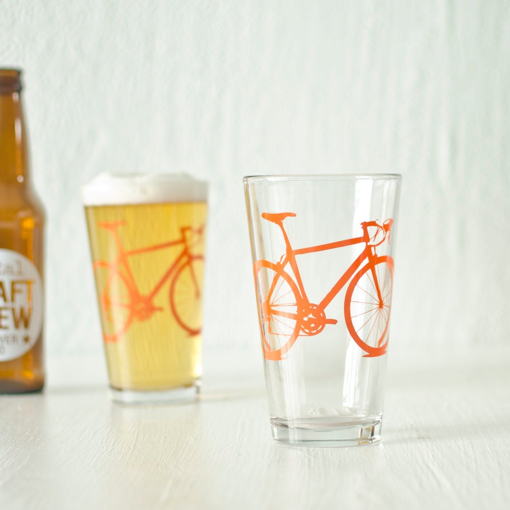 2 bicycle pint glasses, orange bike