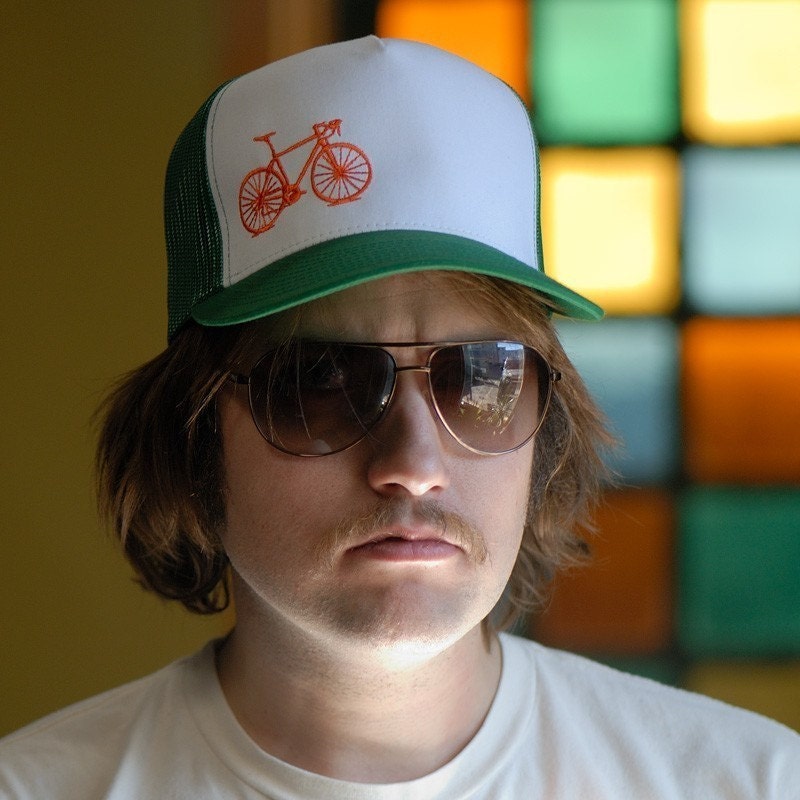 Vital Bicycle - trucker cap, orange on green