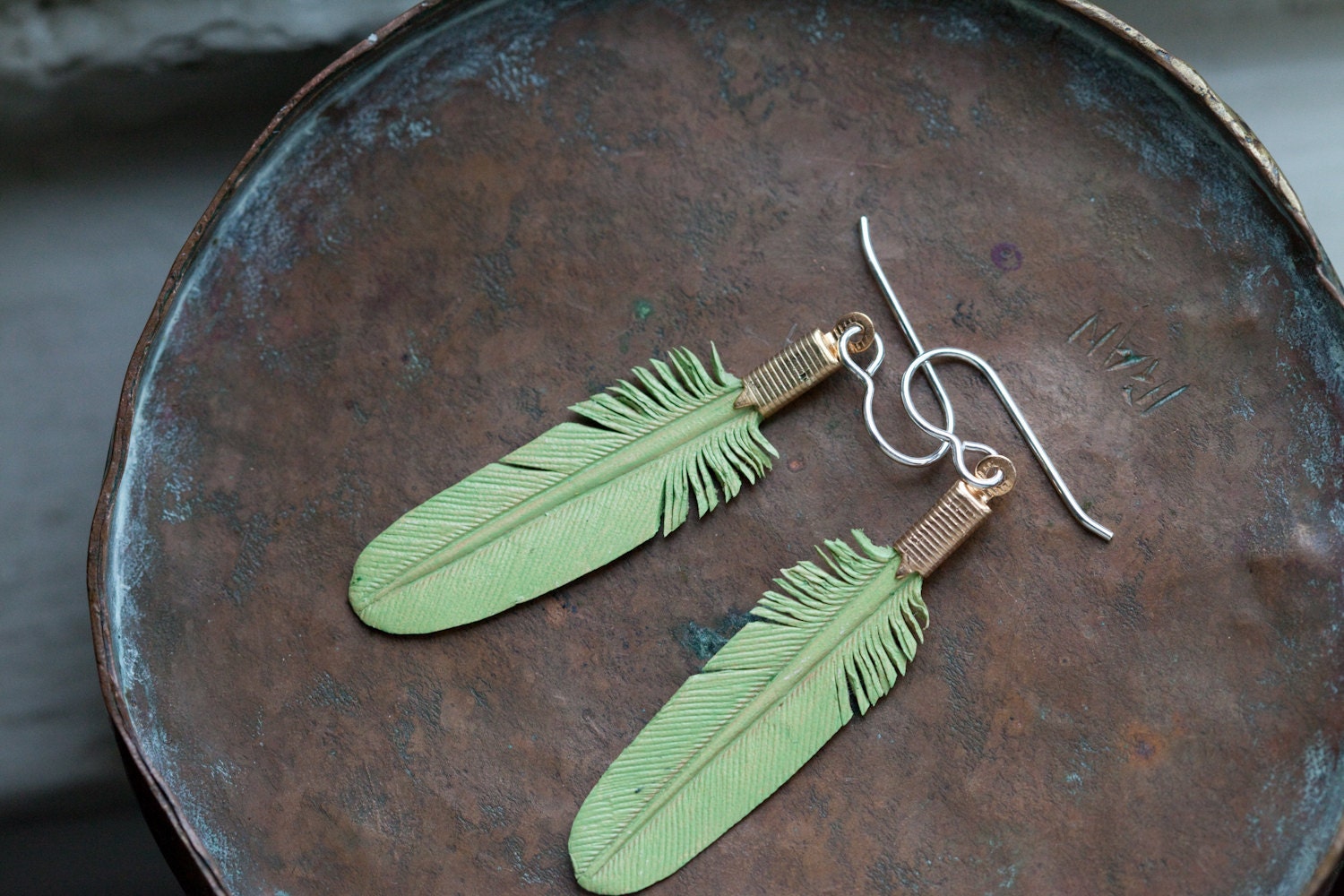small mint green leather feather earrings