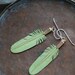 small mint green leather feather earrings