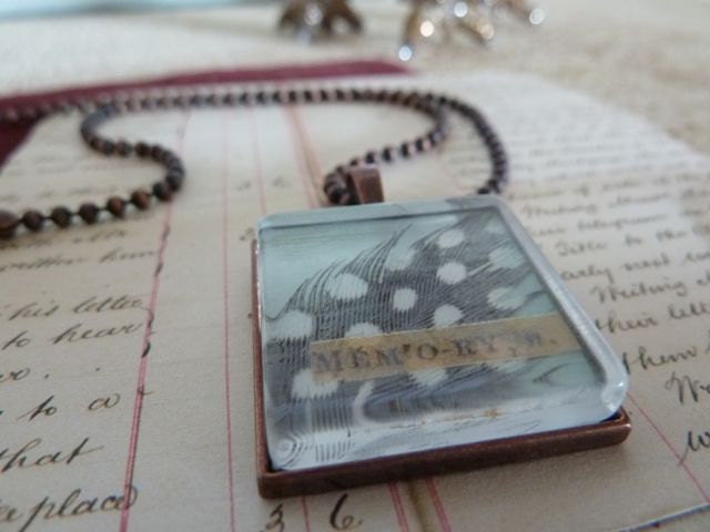 feather collage pendant