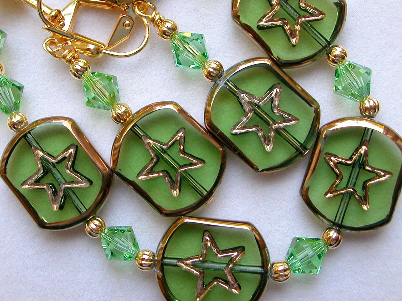 Green Bracelet with Gold Framed Beads and Stars in the Center with Swarovski Crystals