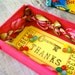Altered vintage matchbox with a tropical bright greeting inside