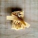SALE Altered vintage matchbox with a delicate gold bell and leaves garland inside