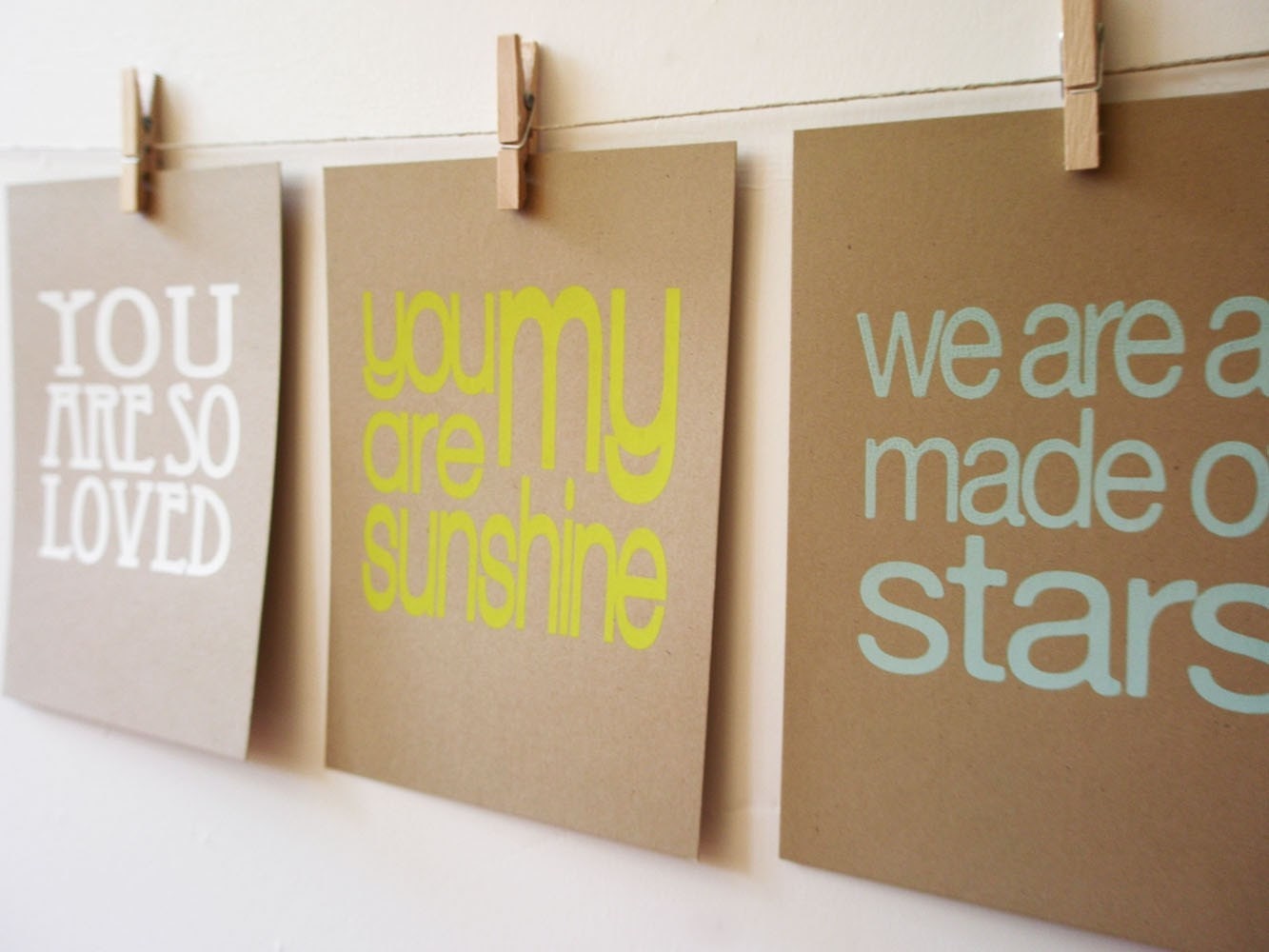 set of 3 screen prints on brown kraft stock