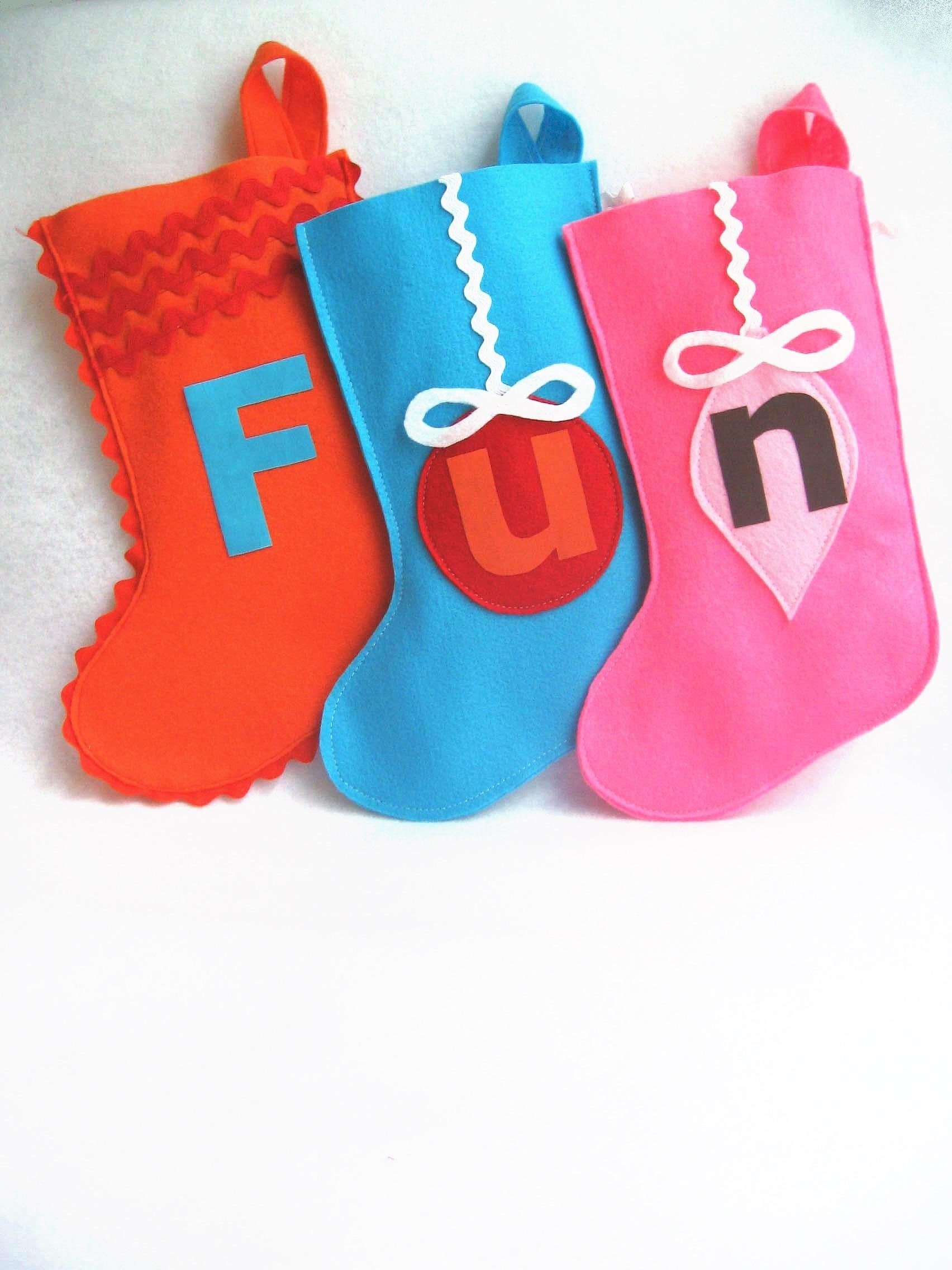your choice of ONE custom initialized felt stocking in fun filled colours