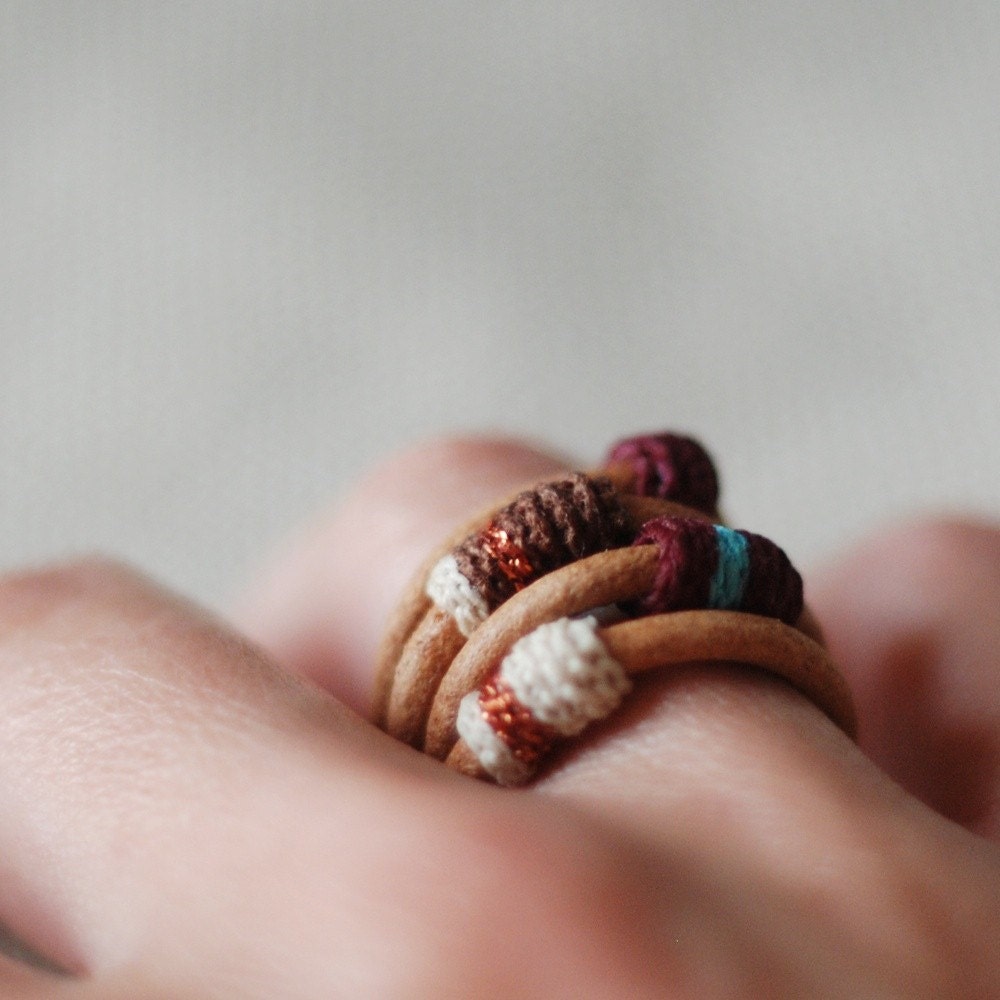 Set of four leather and cotton rings