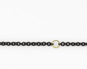 black stainless steel chain and hammered gold . bracelet