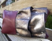ruffled clutch in cranberry and pewter fleather