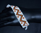 Orange zig zag lattice weave beaded bracelet