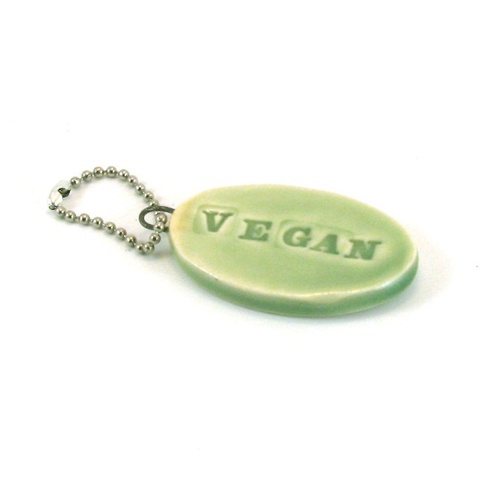 Vegan keychain in green with block lettering.