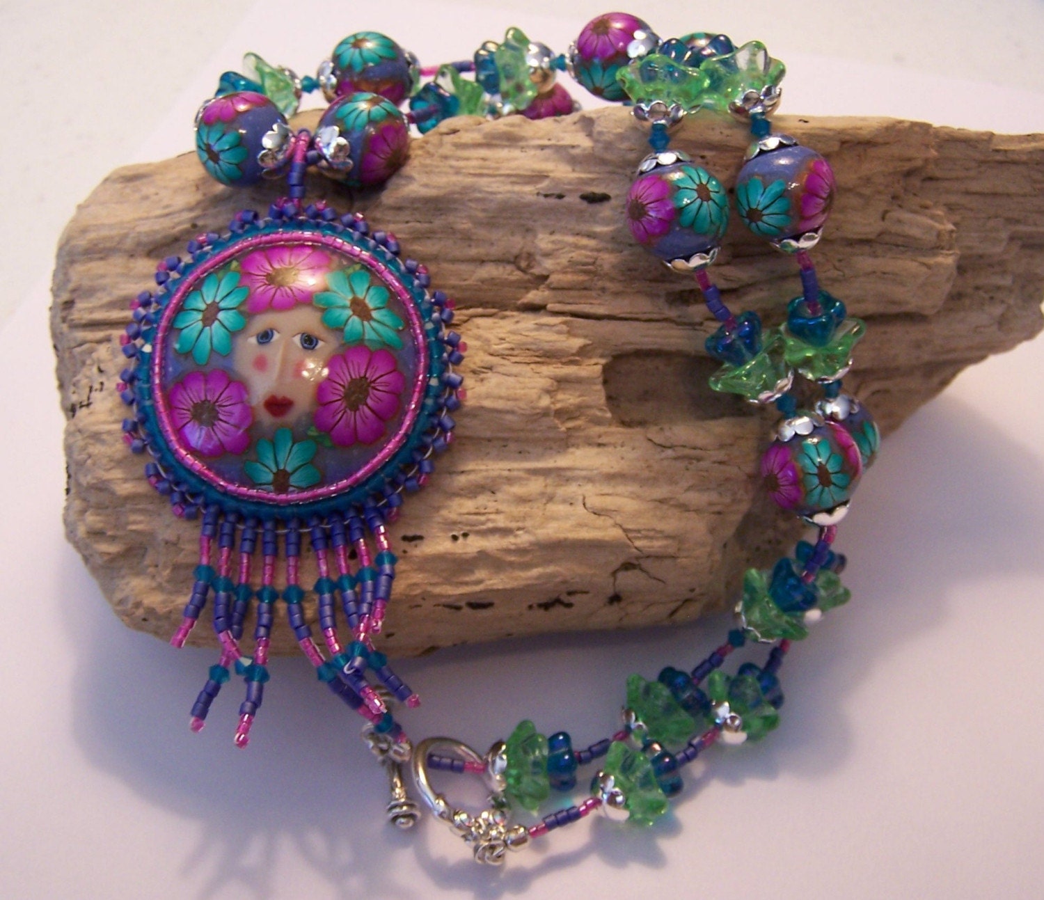 Whimsical Fairy Peeking Throught the Flowers Pendant and Necklace