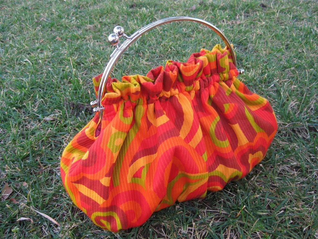 Purse in Swirls of Orange Red Yellow and Green with 8 Inch Frame