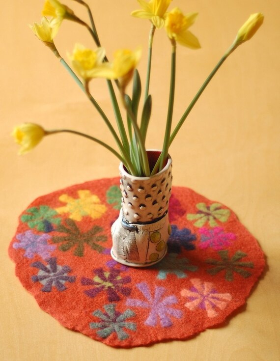 orange pin wheel round table runner