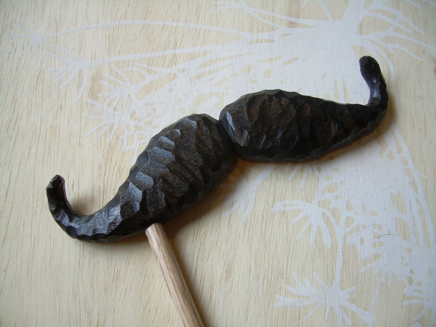 mustache on a stick