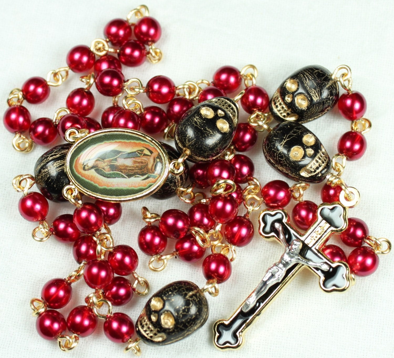 Muertos Skull Rosary in Gold with Red Glass Pearls and Black Skulls