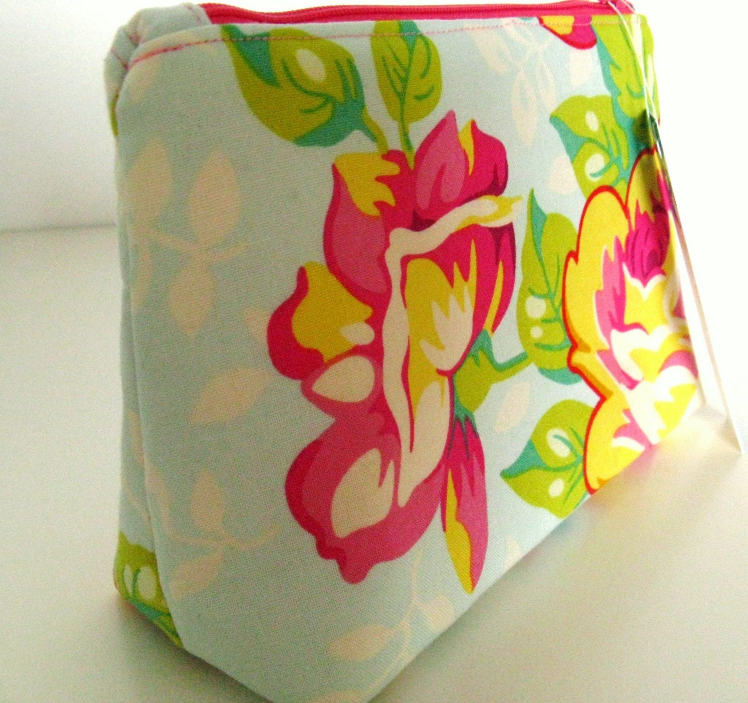 Make up bag in pink rose bloom on ice blue