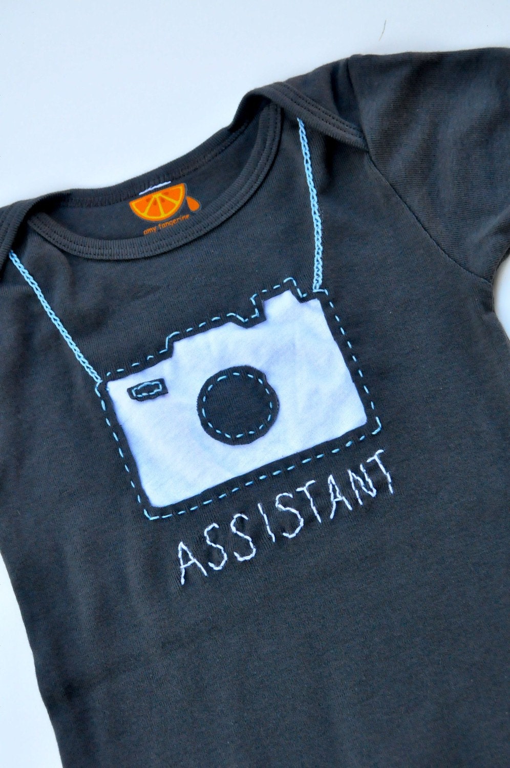 Camera handstitched onesie
